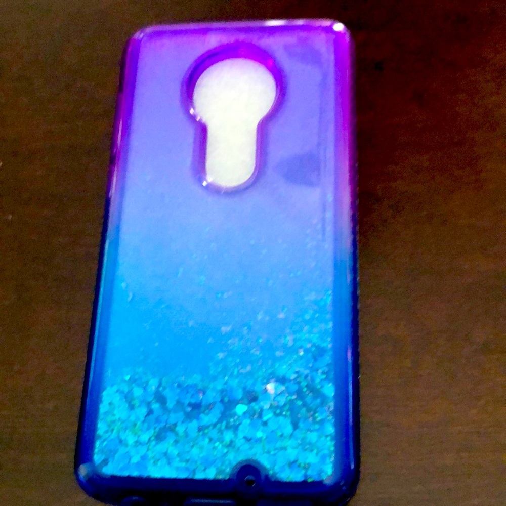 Purple and Blue phone case with floating hearts and “diamonds” along edge